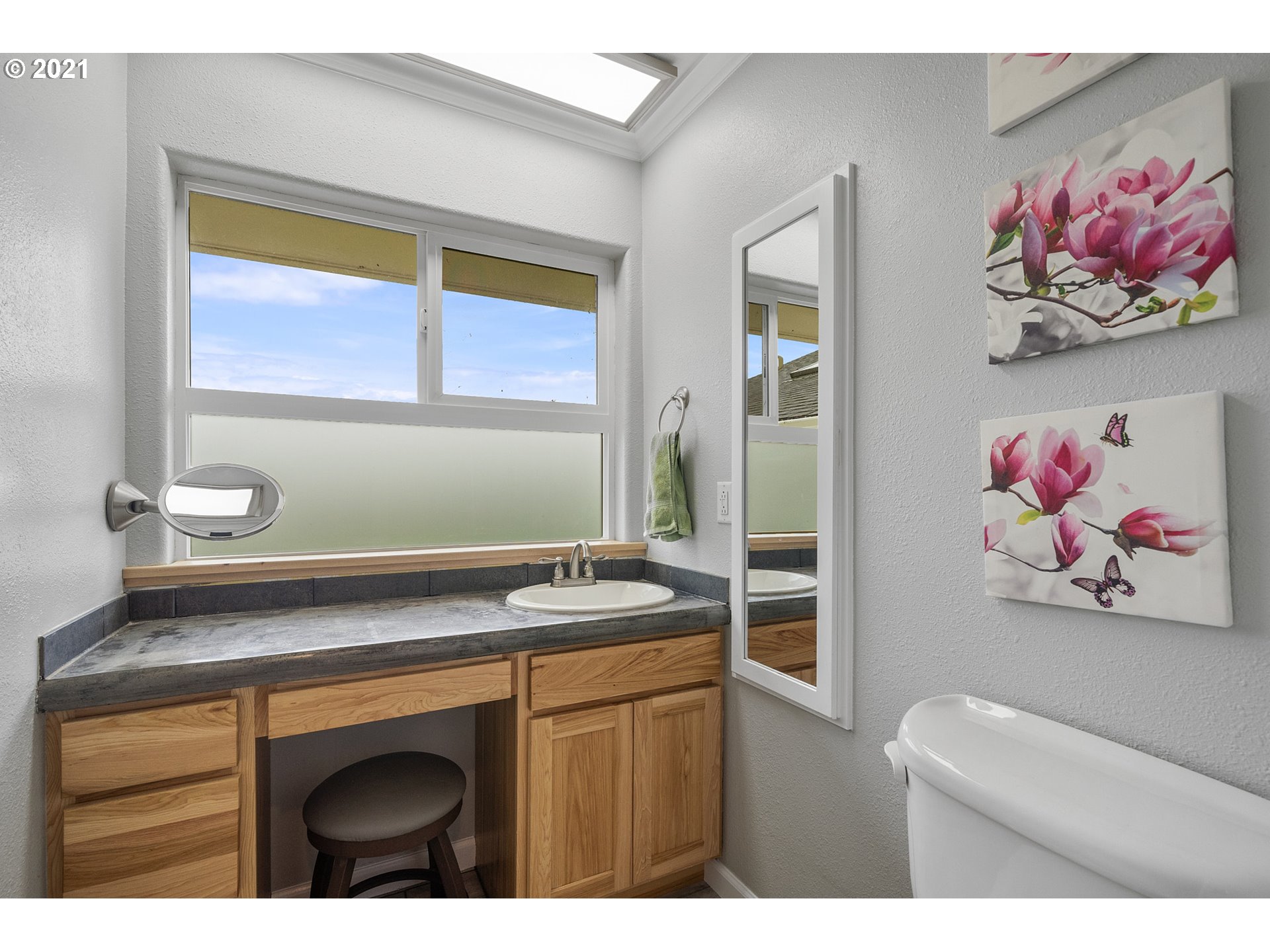 1220 McCormick Loop Road Tillamook, OR 97141 - Photo 24 of 30 a bathroom with a sink a vanity and a window