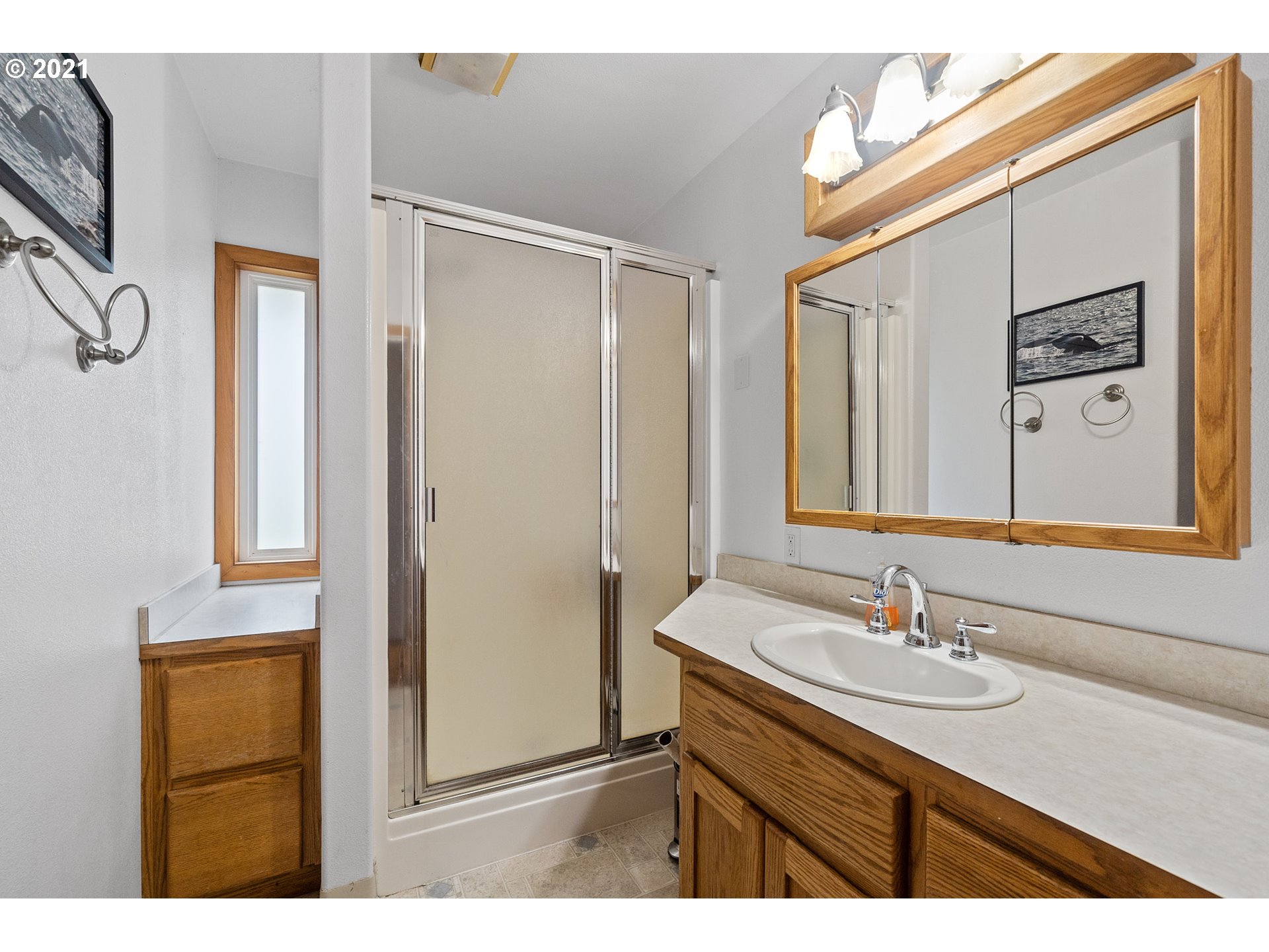 1220 McCormick Loop Road Tillamook, OR 97141 - Photo 28 of 30 a bathroom with a sink double vanity and a mirror