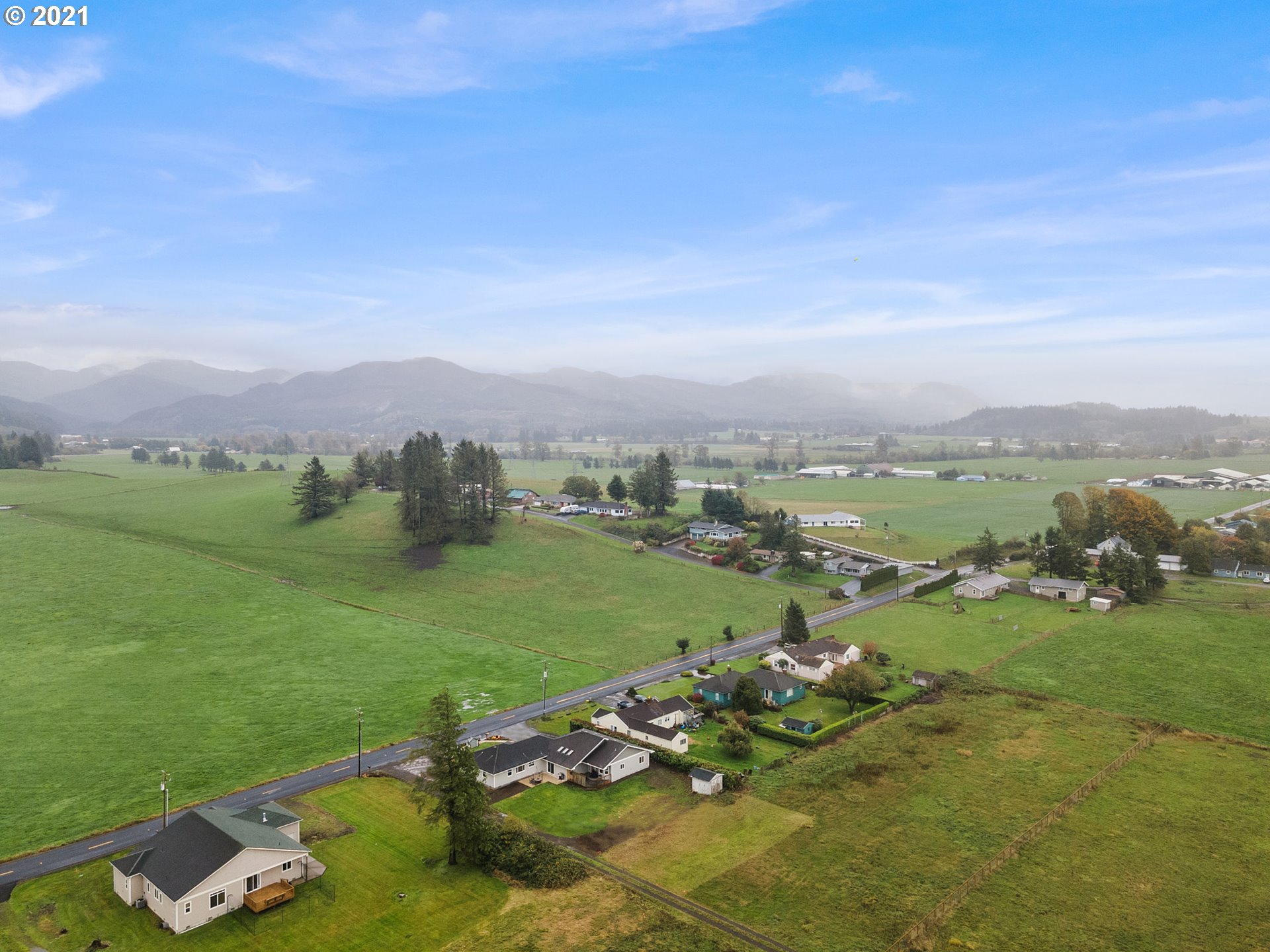 1220 McCormick Loop Road Tillamook, OR 97141 - Photo 4 of 30 a view of a golf course with chairs