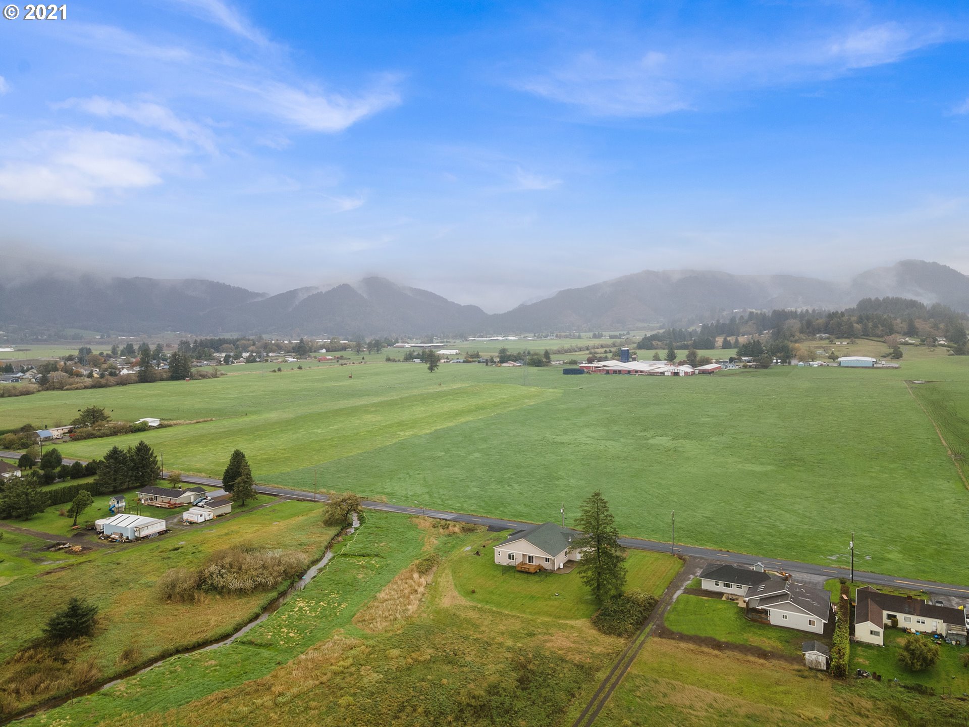 1220 McCormick Loop Road Tillamook, OR 97141 - Photo 5 of 30 a view of a lake with a mountain in the background