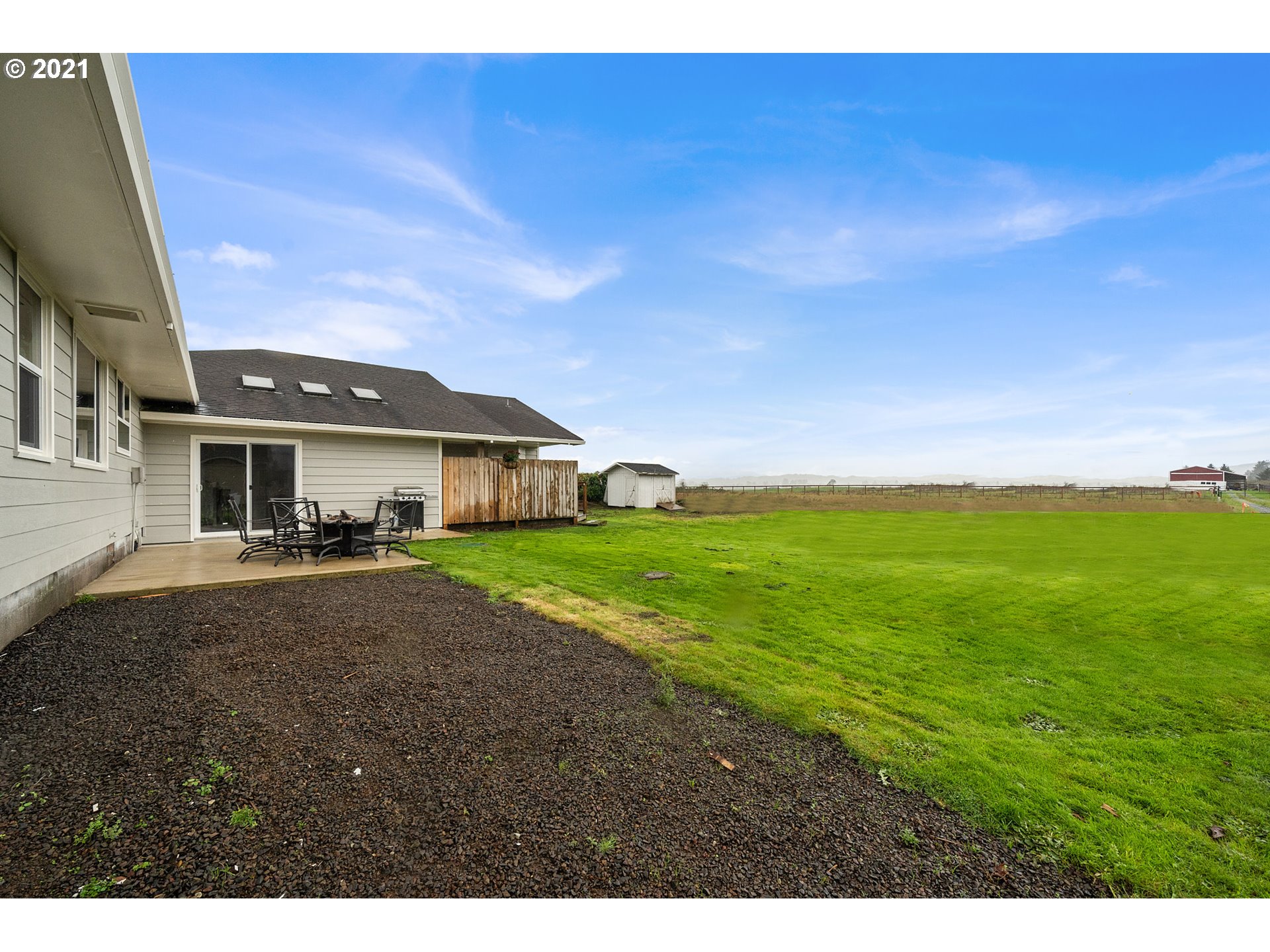 1220 McCormick Loop Road Tillamook, OR 97141 - Photo 9 of 30 a front view of a house with a garden