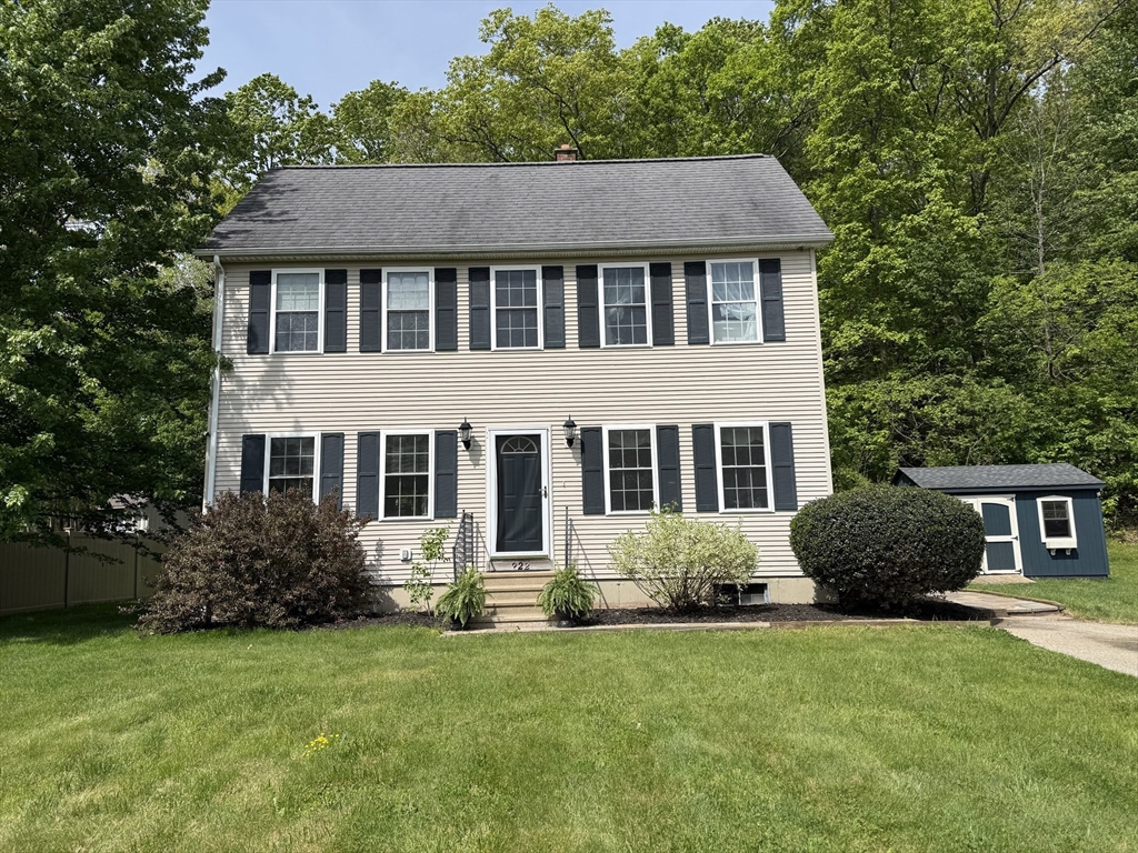 a front view of a house with a garden and porch