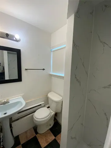 a kitchen with sink stove and cabinets