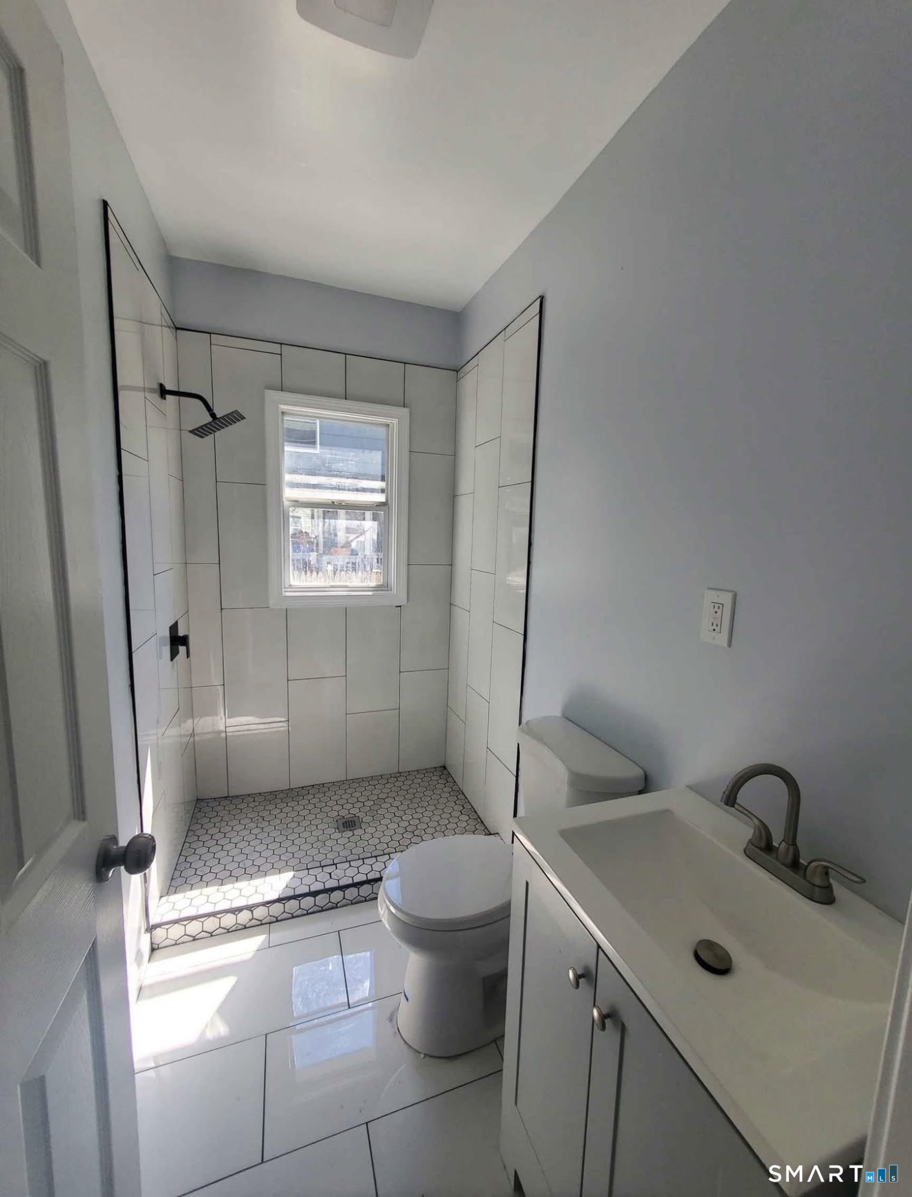 100 Horace Street Bridgeport, CT 06610 - Photo 6 of 8 a bathroom with a sink toilet and shower