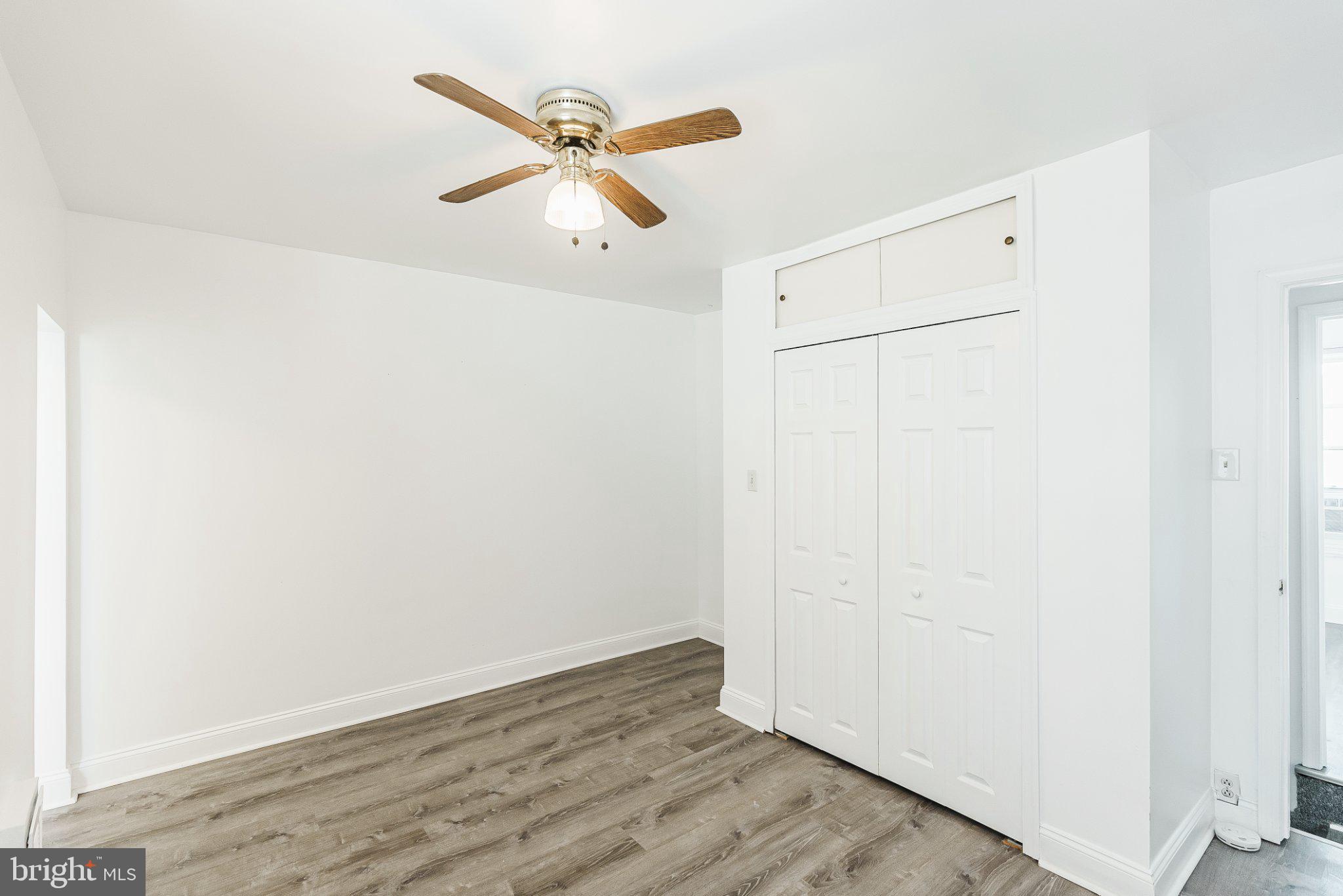 724 Moyer Street Philadelphia, PA 19125 - Photo 14 of 25 an empty room with wooden floor closet and fan