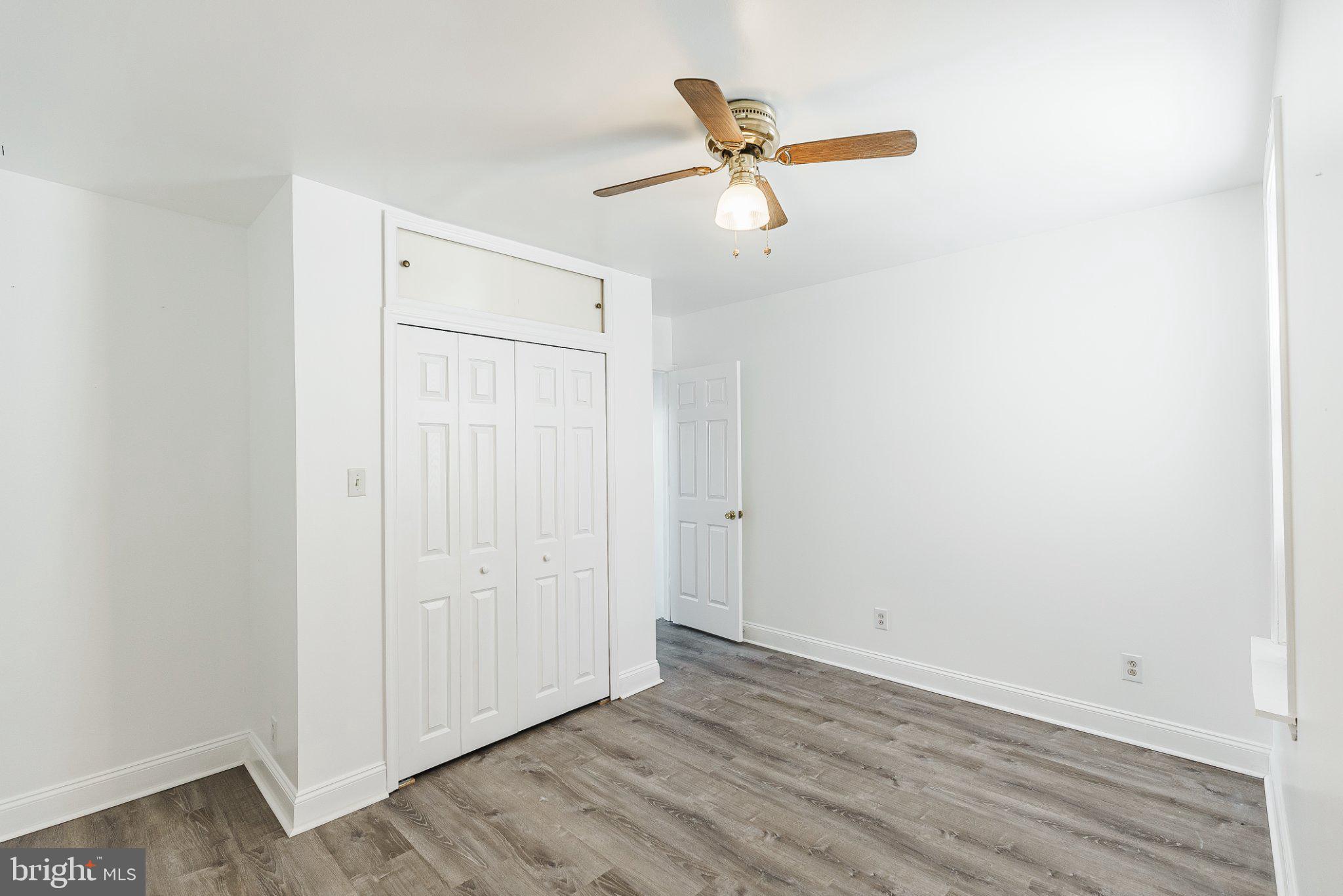 724 Moyer Street Philadelphia, PA 19125 - Photo 15 of 25 a view of a room with wooden floor and a ceiling fan