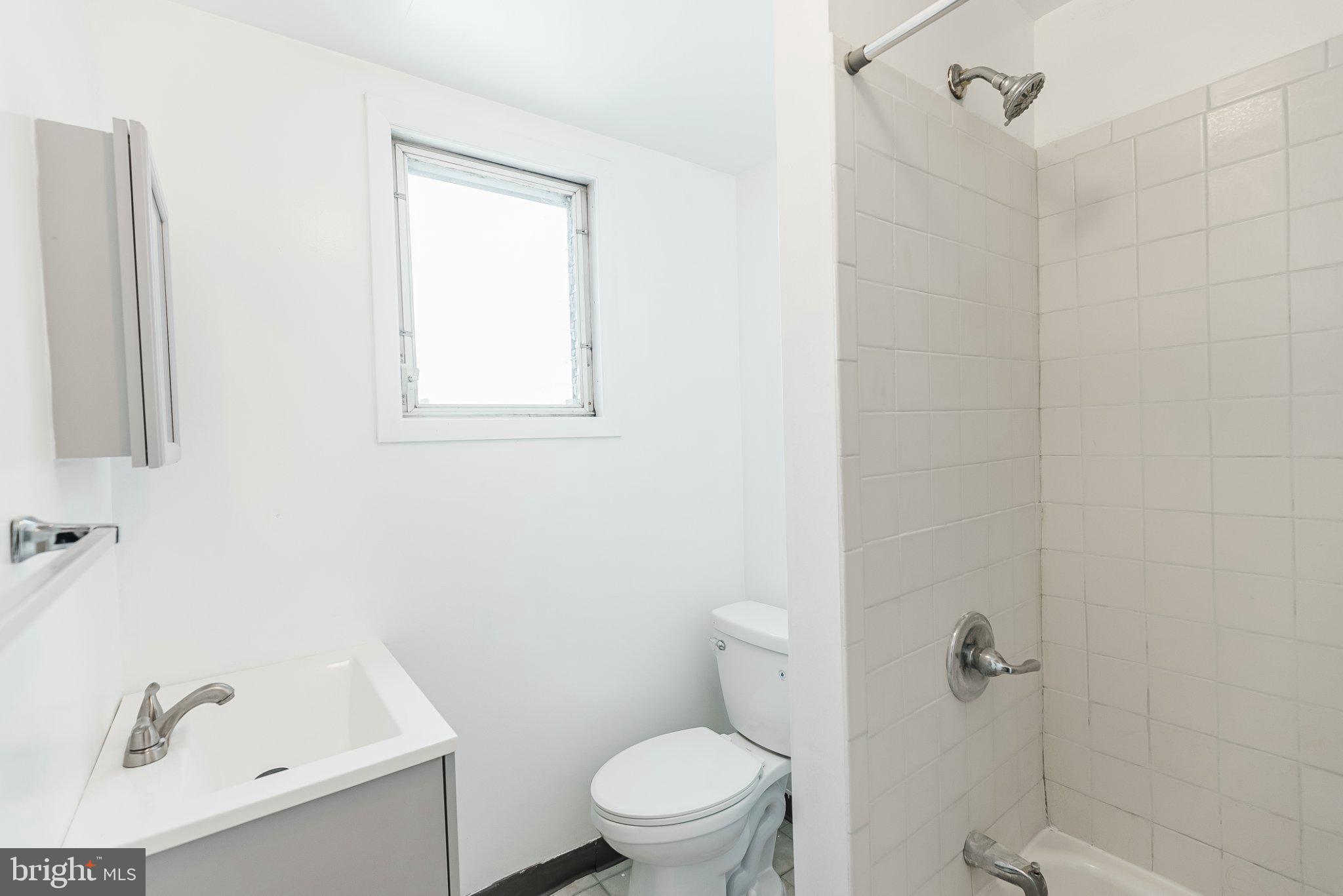 724 Moyer Street Philadelphia, PA 19125 - Photo 17 of 25 a white toilet sitting next to a bath tub