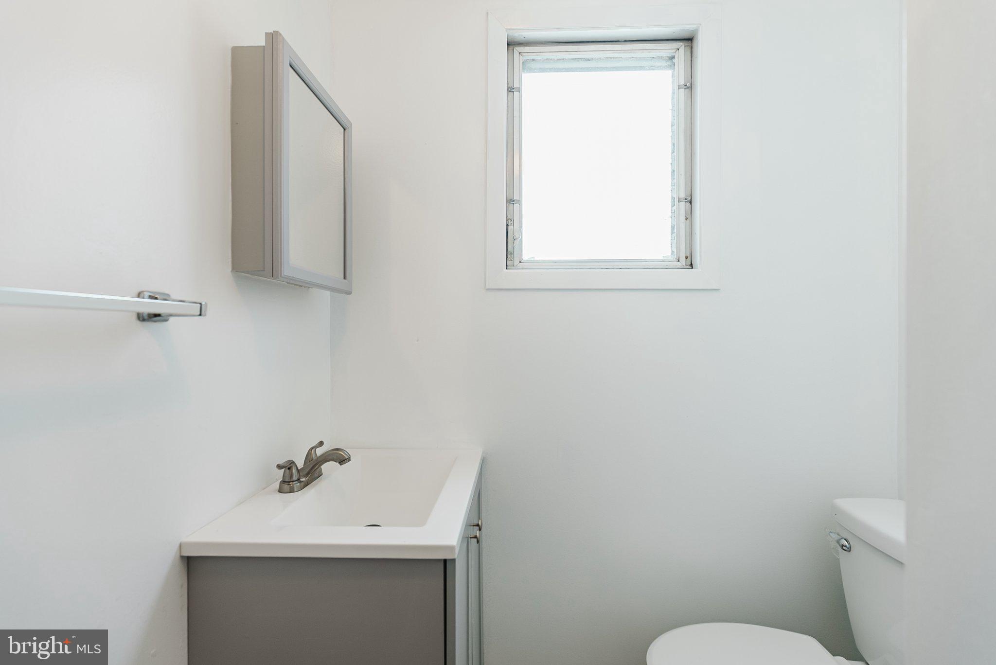 724 Moyer Street Philadelphia, PA 19125 - Photo 18 of 25 a bathroom with a sink toilet