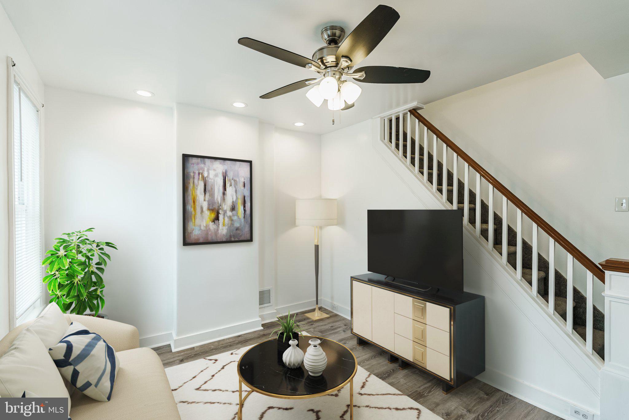724 Moyer Street Philadelphia, PA 19125 - Photo 2 of 25 a living room with furniture and a flat screen tv