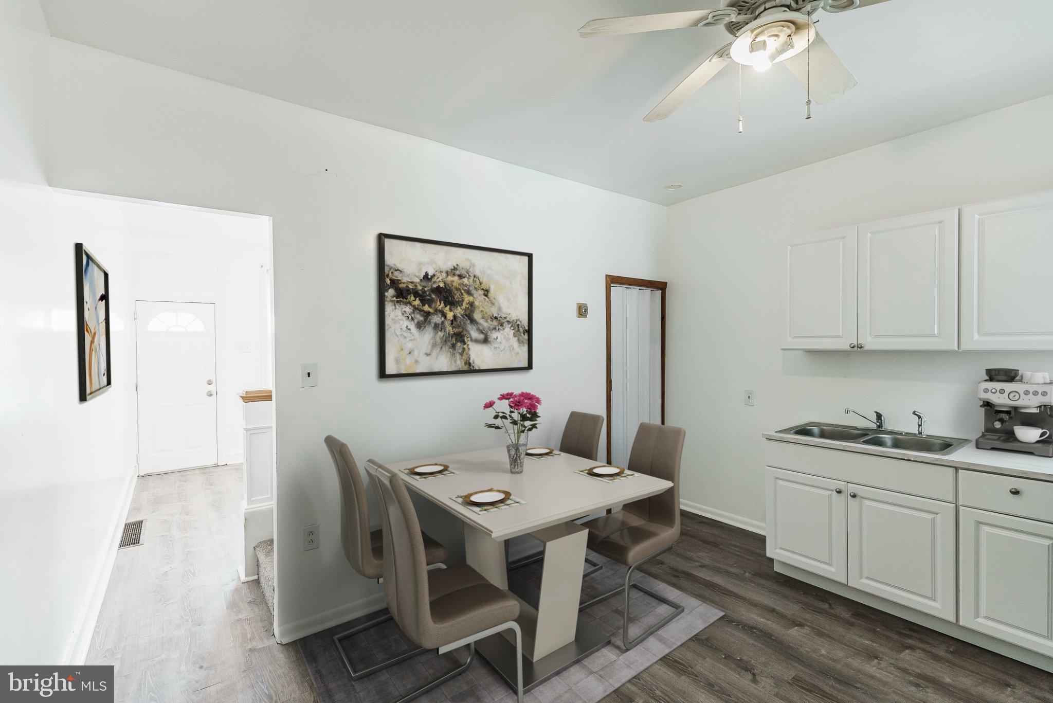 724 Moyer Street Philadelphia, PA 19125 - Photo 3 of 25 a view of a kitchen area with furniture and wooden floor