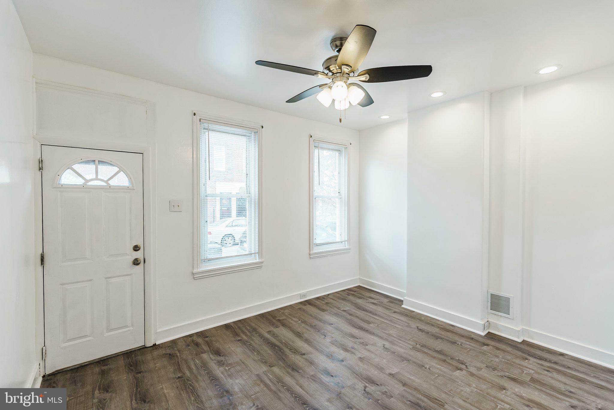 724 Moyer Street Philadelphia, PA 19125 - Photo 10 of 25 an empty room with wooden floor closet and windows