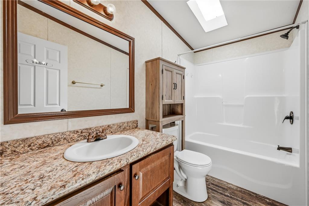 69 South Summit Road, Unit 409 Greenville, PA 16125 - Photo 19 of 41 a bathroom with a granite countertop sink toilet and shower