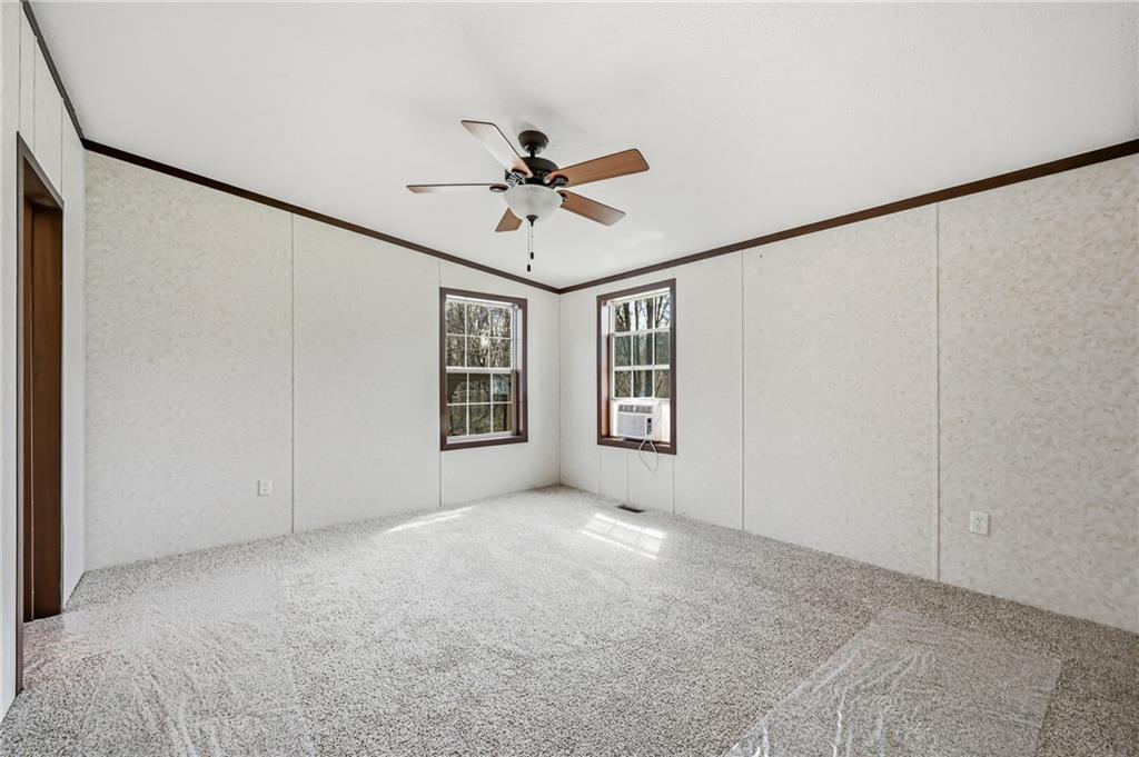69 South Summit Road, Unit 409 Greenville, PA 16125 - Photo 20 of 41 a view of a big room with windows and chandelier fan