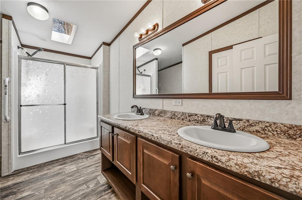 69 South Summit Road, Unit 409 Greenville, PA 16125 - Photo 23 of 41 a bathroom with a granite countertop sink and a mirror