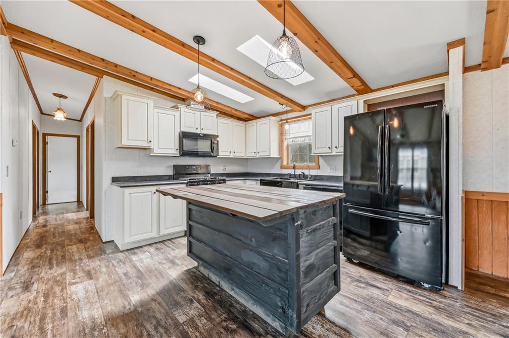69 South Summit Road, Unit 409 Greenville, PA 16125 - Photo 7 of 41 a kitchen with stainless steel appliances granite countertop a stove and a refrigerator