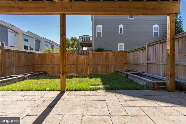 a view of a livingroom with a fireplace wooden floor and staircase