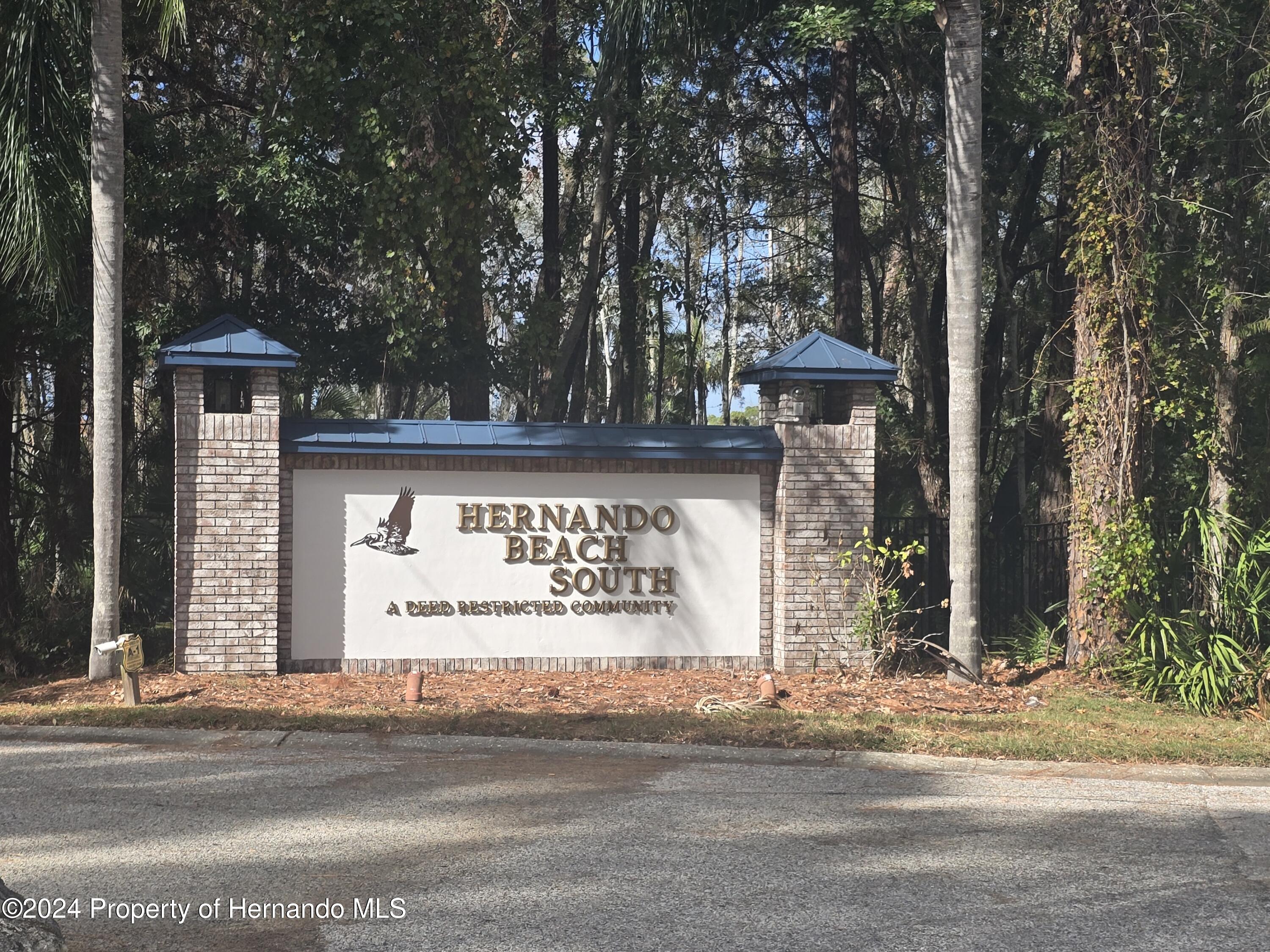 3415 Sheephead Drive Hernando Beach, FL 34607 - Photo 4 of 6 a sign that is on the side of the road