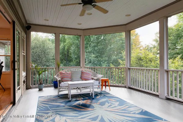 a bathroom with a bathtub and a window