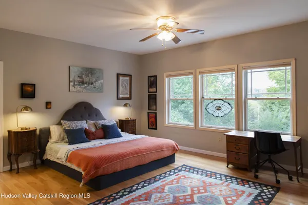 a bathroom with a sink vanity and mirror