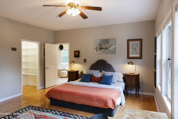 a bathroom with a sink a toilet and a window
