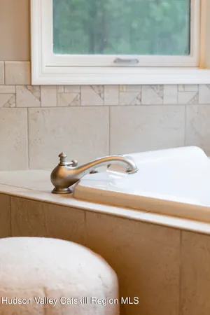 a room with furniture and a large window