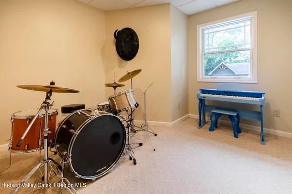 an aerial view of a house with a yard