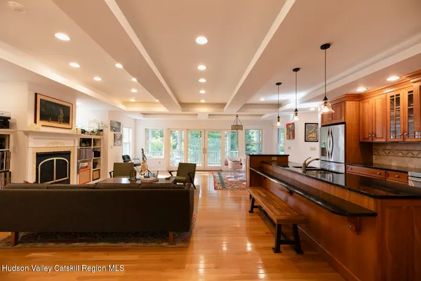 a kitchen with stainless steel appliances granite countertop a stove and a refrigerator