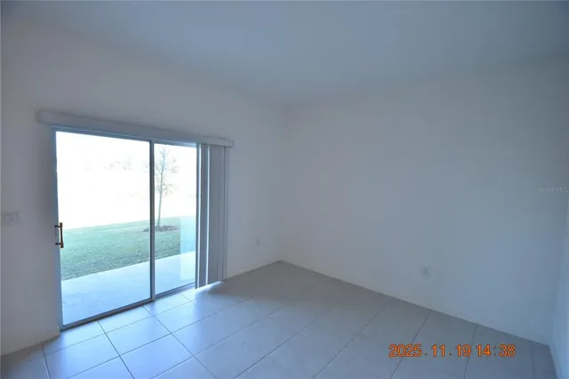 a kitchen with kitchen island a sink a stove a refrigerator and a stove