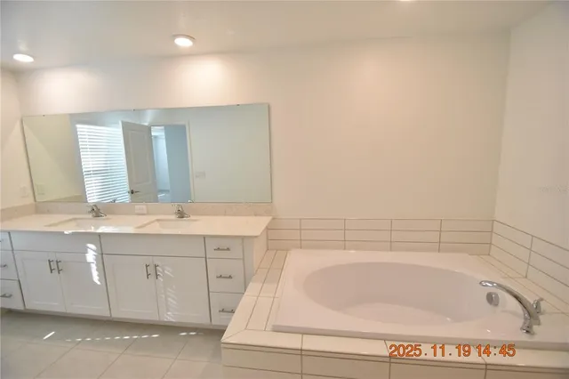 an empty room with a ceiling fan and a window