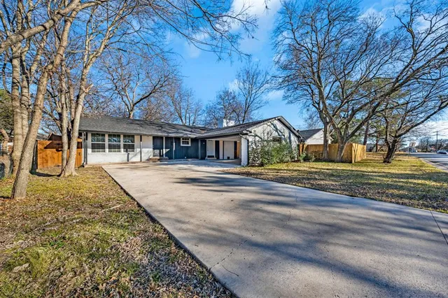 a view of house with yard