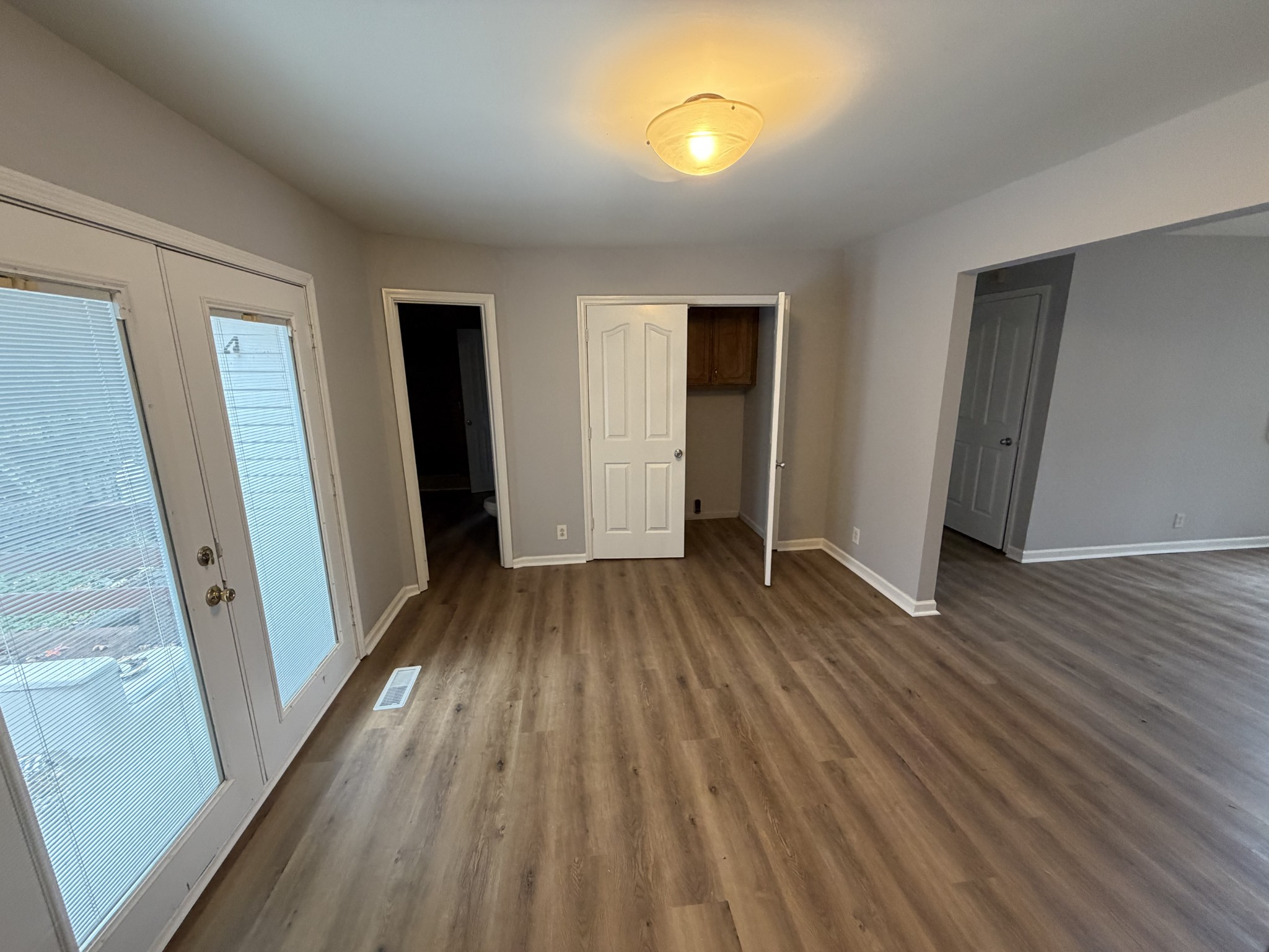 1102 Falling Tree Court Murfreesboro, TN 37130 - Photo 3 of 9 wooden floor in an empty room with a window
