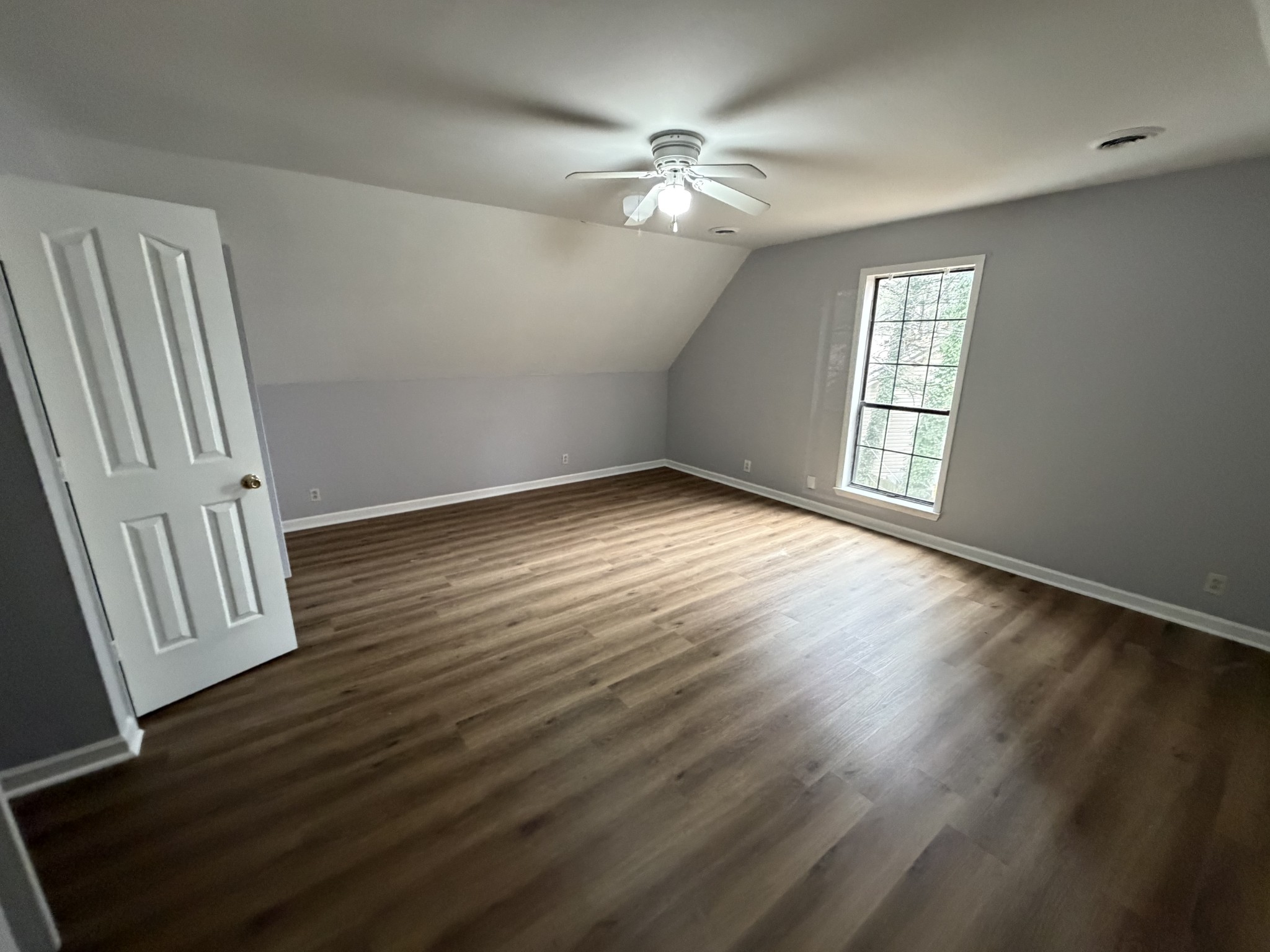 1102 Falling Tree Court Murfreesboro, TN 37130 - Photo 8 of 9 a view of an empty room with wooden floor and a window