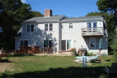 317 Lower County Road Harwich Port, MA 02646 - Photo 3 of 27 a front view of a house with a yard