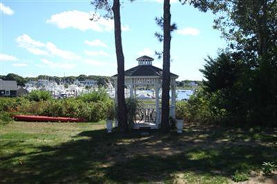 317 Lower County Road Harwich Port, MA 02646 - Photo 4 of 27 a front view of a house with a yard and mountain view in back