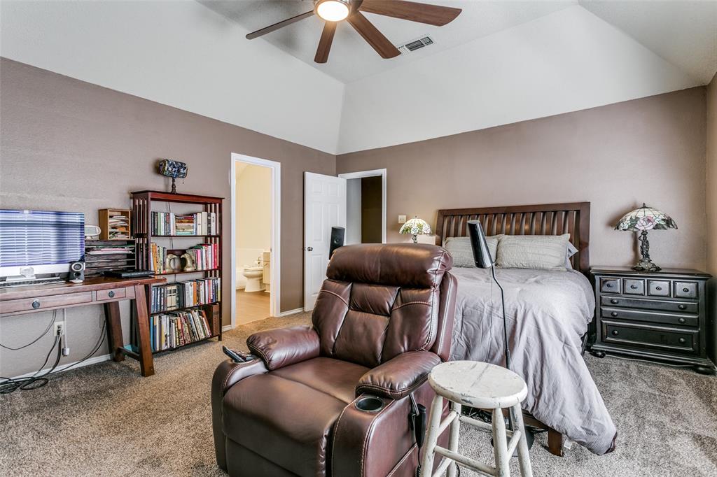 2133 Rim Rock Drive Keller, TX 76248 - Photo 23 of 37 Carpeted bedroom featuring ceiling fan, connected bathroom, and lofted ceiling