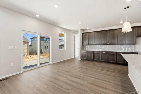 a view of a kitchen with a sink and a large window