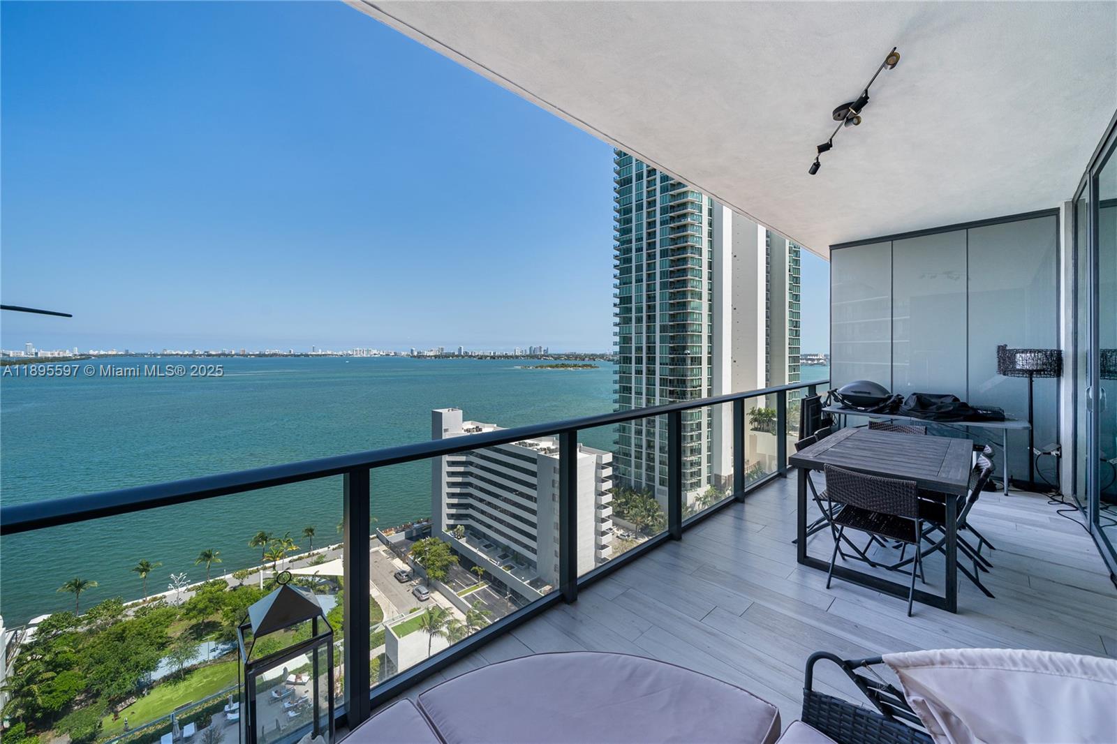 480 Northeast 31st Street, Unit 1603 Miami, FL 33137 - Photo 12 of 14 a view of a balcony with chairs