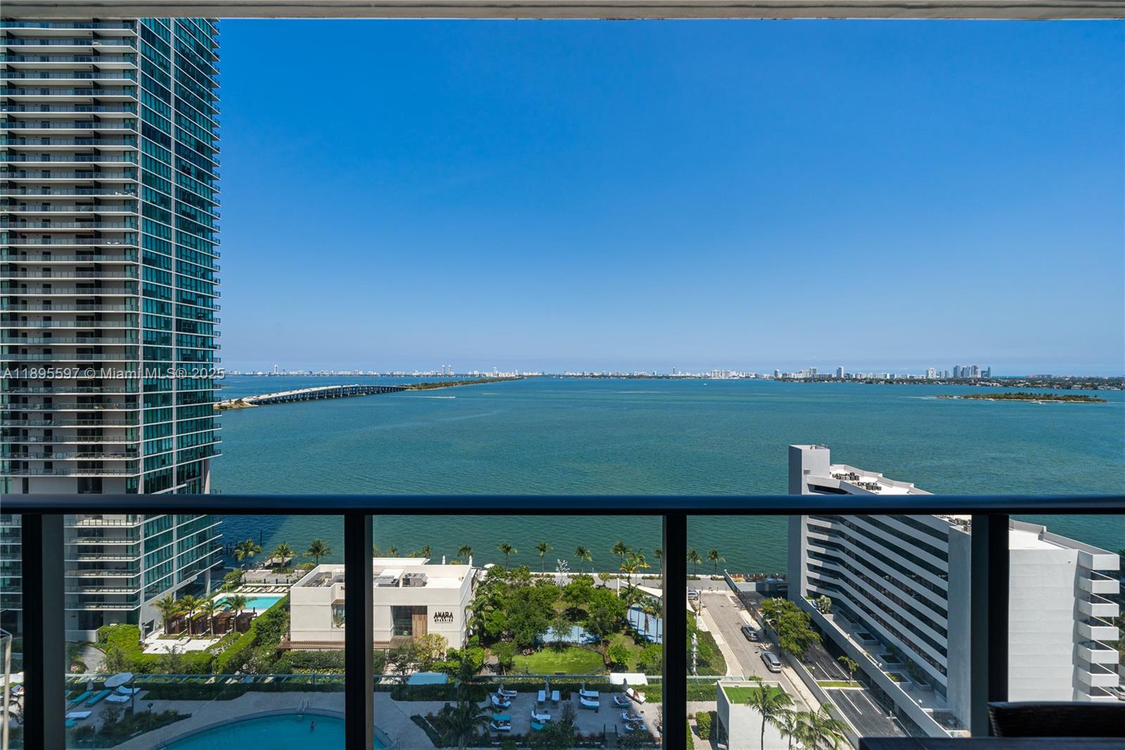480 Northeast 31st Street, Unit 1603 Miami, FL 33137 - Photo 5 of 14 a view of a balcony with lake view and a floor to ceiling window