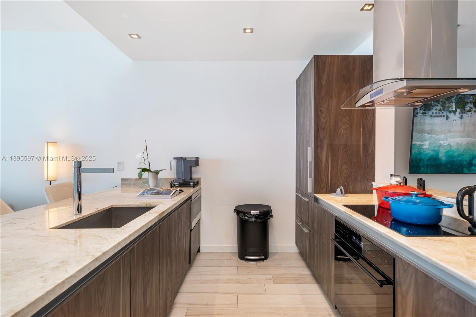 480 Northeast 31st Street, Unit 1603 Miami, FL 33137 - Photo 8 of 14 a kitchen with stainless steel appliances granite countertop a sink and dishwasher
