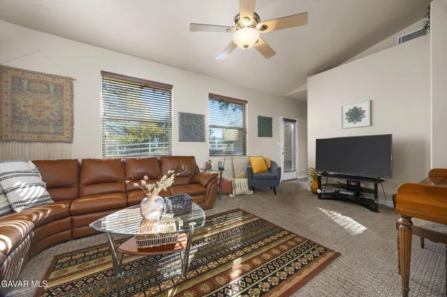 a large kitchen with stainless steel appliances lots of counter space and a refrigerator