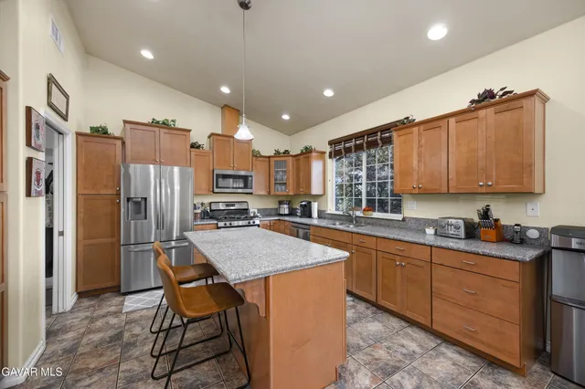 a view of a livingroom with workspace and a window