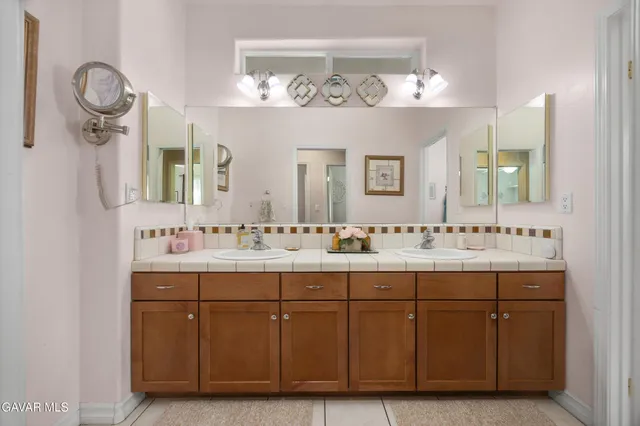 a view of a storage & utility room with a fridge