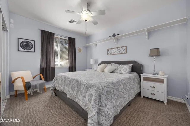 a view of a patio with table and chairs and potted plants