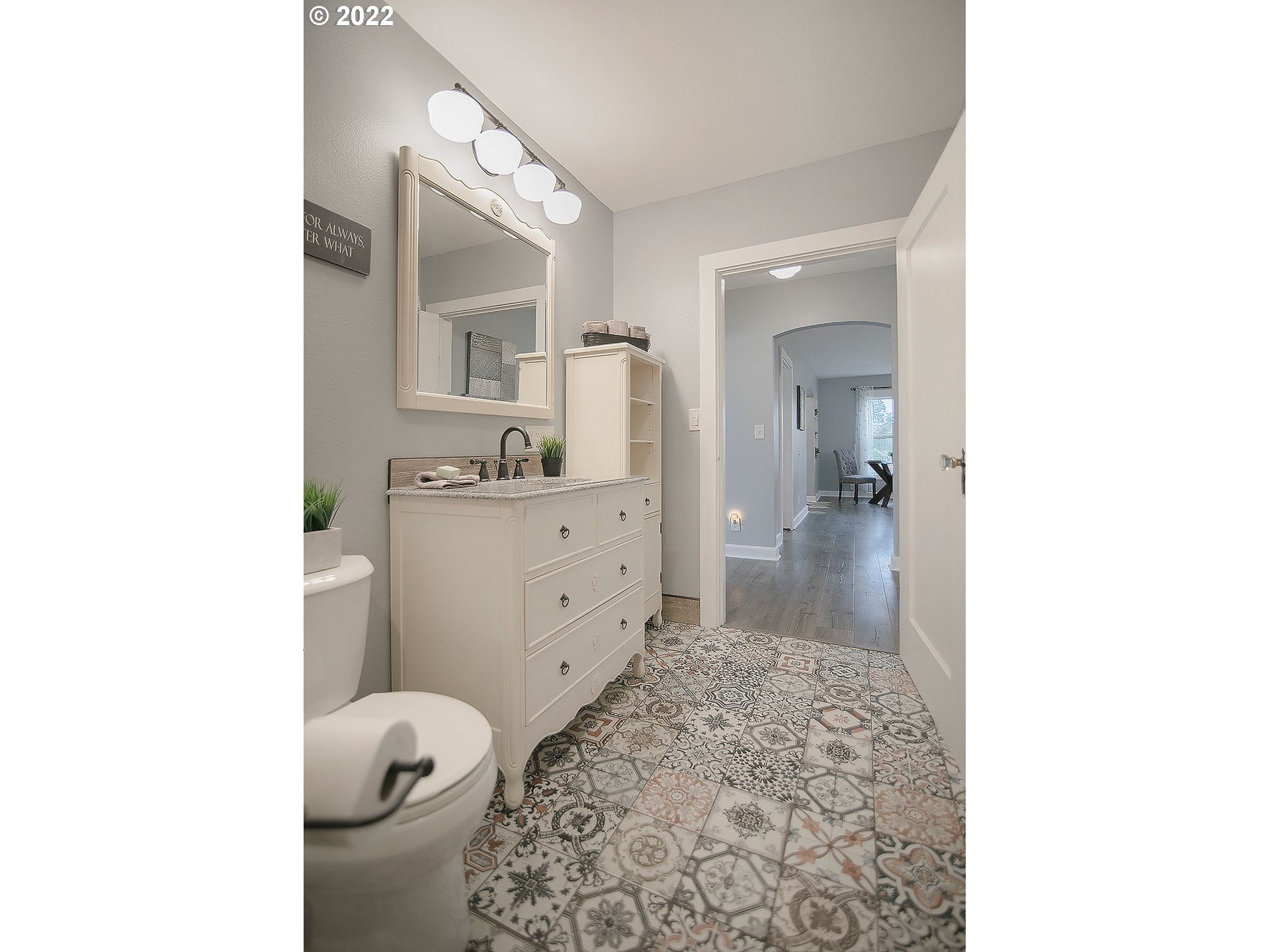 121 Rarey Road Winlock, WA 98596 - Photo 19 of 32 a bathroom with a sink toilet a mirror and vanity