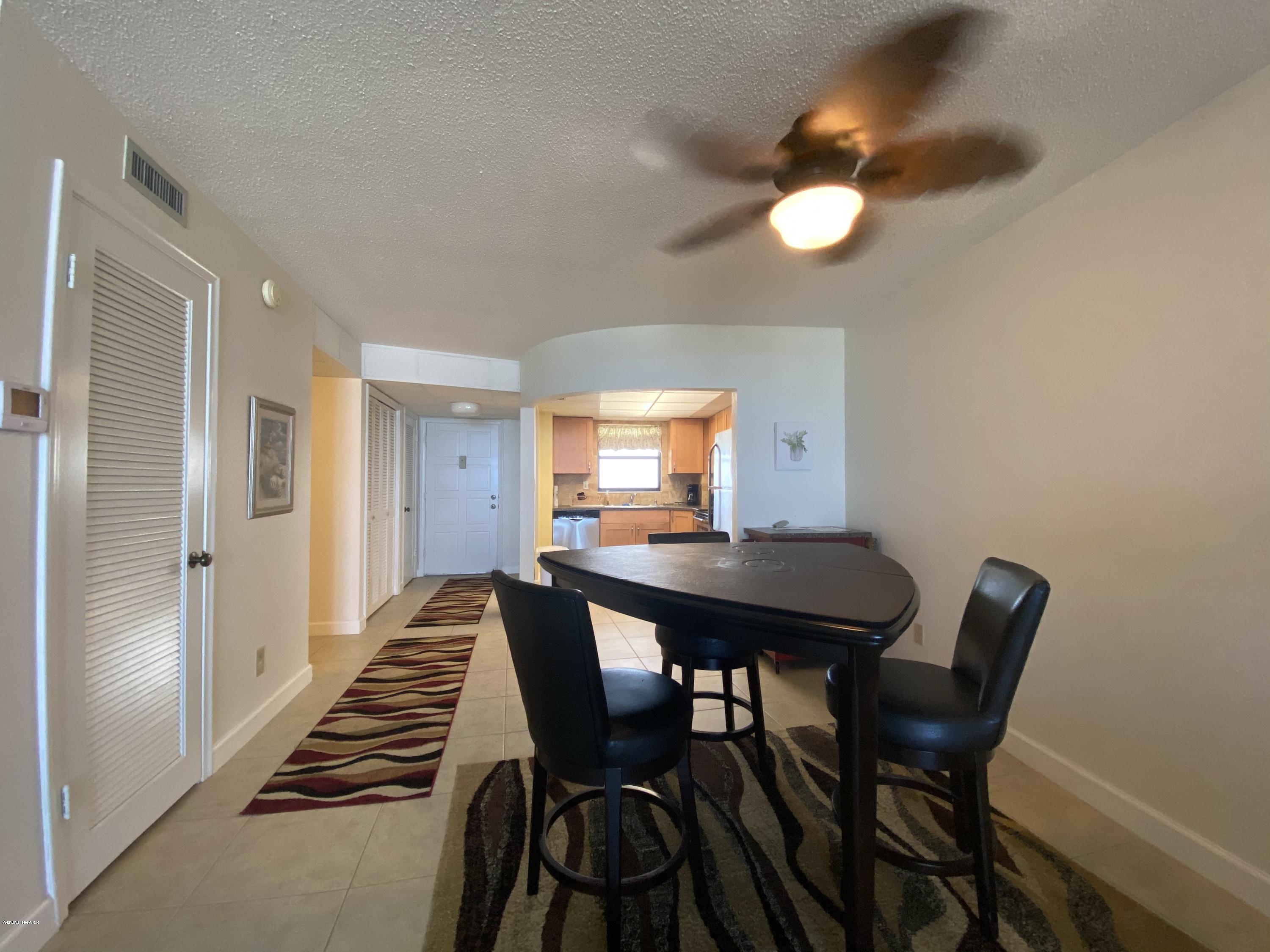 915 Ocean Shore Boulevard, Unit 4030 Ormond Beach, FL 32176 - Photo 9 of 37 Dining Area to Kitchen