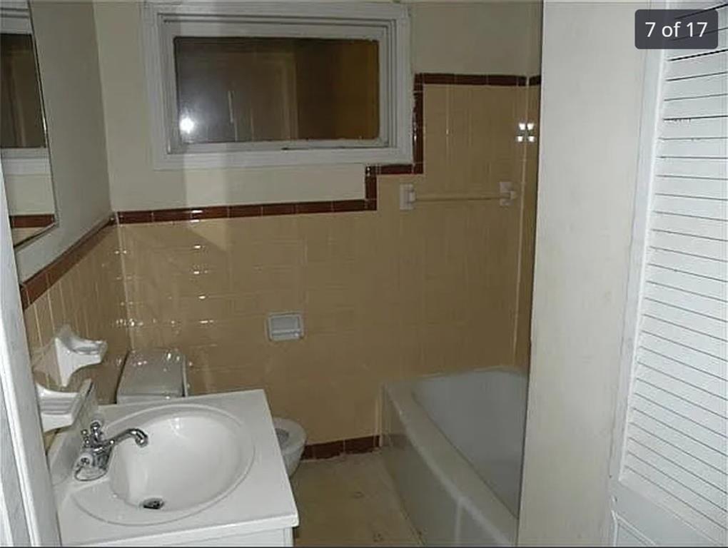 2041 Olive Springs Road Southeast Marietta, GA 30060 - Photo 4 of 6 a bathroom with a sink and mirror