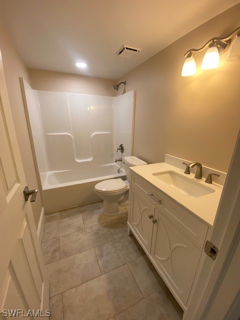 16007 Davis Road, Unit 515 Fort Myers, FL 33908 - Photo 11 of 14 a bathroom with a granite countertop sink toilet and shower