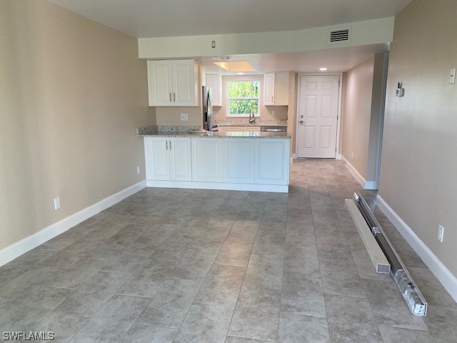 16007 Davis Road, Unit 515 Fort Myers, FL 33908 - Photo 4 of 14 a view of a kitchen with a sink and cabinets