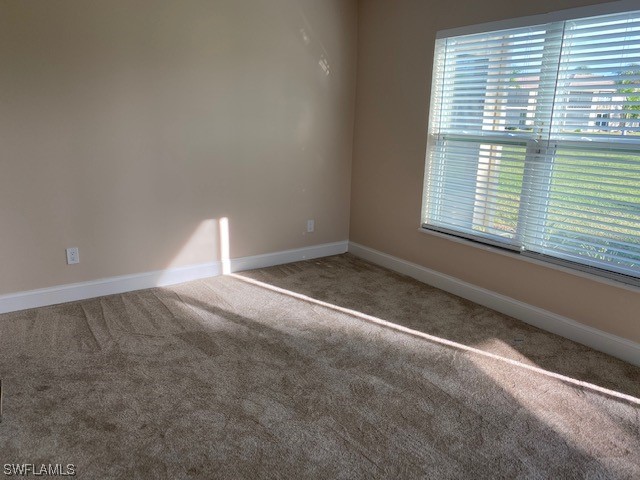 16007 Davis Road, Unit 515 Fort Myers, FL 33908 - Photo 7 of 14 a view of an empty room with a window