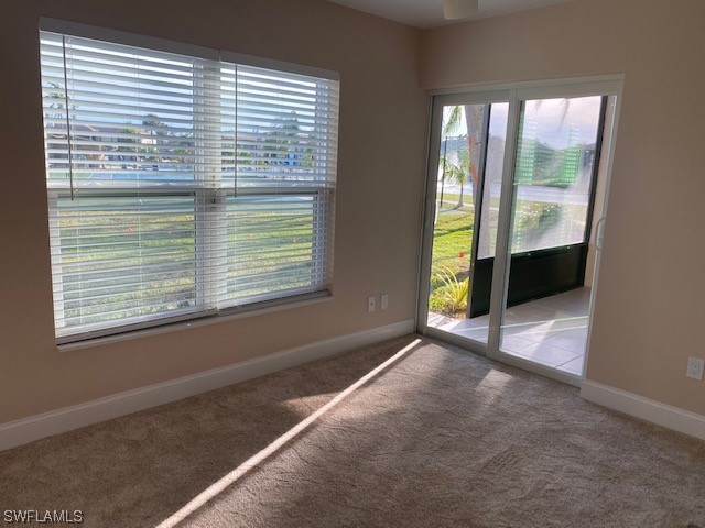 16007 Davis Road, Unit 515 Fort Myers, FL 33908 - Photo 8 of 14 a view of an empty room with a window